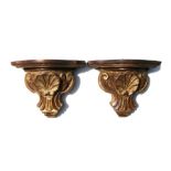 A pair of Italian carved giltwood wall brackets, 30cms high.