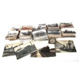 A large quantity of postcards, cigarette cards and a quantity of real photographs depicting