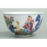 A Chinese Republic style enamelled bowl decorated with a small boy and a chicken with calligraphy,