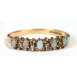 A 9ct gold diamond and opal ring, approx UK size 'R', 1.6g.