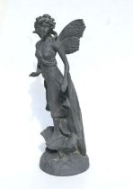 A lead style garden statue in the form of a fairy, 53cms high.