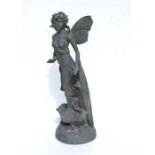 A lead style garden statue in the form of a fairy, 53cms high.