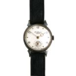 A vintage manual wind gentleman's wristwatch by J W Benson, the silvered dial with Arabic numerals