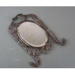 A 19th century silver plated mirror decorated with grape and vine, 0verall 19 by 25cms.