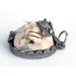 A Charivari German huntsman pendant with a full set of pole cat teeth, 3.5cms long.