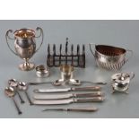 A silver six-division toast rack; together with a silver sugar bowl; a silver trophy cup and other