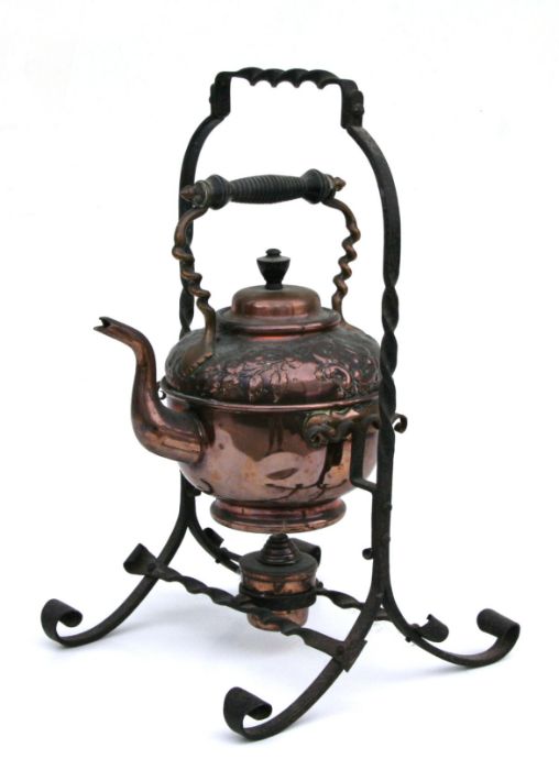 A Christopher Dresser design style copper spirit kettle on stand, 37cms high.