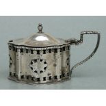 A pierced silver mustard pot, London 1969, 107g.