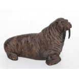 An Austin Productions Inc. bronzed Durastone study of a walrus, 34cms long.