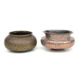 An Islamic tinned copper bowl, 22cms diameter; together with an Indo-Persian brass bowl decorated