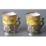 A pair of Crown Staffordshire silver mounted cabinet cups, 6cms high, silver weight 58g (2).