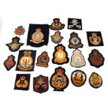A group of military cloth badges.