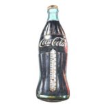 A vintage tin Coca Cola advertising wall mounted thermometer, 76cms high.