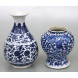 A Chinese blue & white baluster vase decorated with scrolling flowering foliage, blue seal mark to