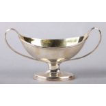 A George III silver two-handled navette form pedestal salt with gilded interior, London 1787 and