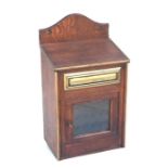 A late 19th / early 20th century brass bound oak country house letters box, the sloped top above