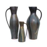 Three Julie Ayton Studio pottery jugs, the largest 53cms high (3).Condition ReportThe tall thin
