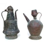 A Middle Eastern tinned copper coffee pot, 39cm high, together with a similar copper jug 31cm