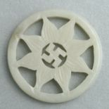 A Chinese jade / hardstone pierced pendant, 5.5cms diameter.