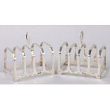 A pair of silver four-division toast racks, Birmingham 1934, each 7cms wide, 91g (2).