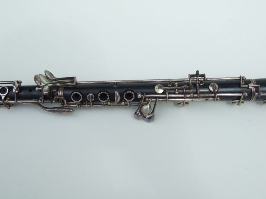 A three-piece ebony oboe by F Busson, 60cms long, cased. - Image 3 of 12