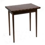 An Edwardian mahogany card table with shaped rectangular fold-over top, on tapering square legs,