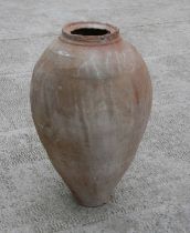 A large Mediterranean terracotta olive jar, 70cms high.