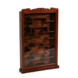 A Chinese carved hardwood wall mounted display cabinet, 51cms wide.