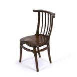 A child's liberty style mahogany chair with solid heart shaped seat with engraved decoration, on