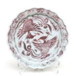 A Chinese underglaze red shallow dish decorated with two phoenix, 17cms diameter
