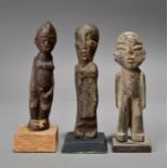 Three Lobi standing male figures, Burkina Faso one with string tied around his ankles, 14cm, 14.