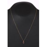 A 9ct gold necklace with amethyst pendant drop.