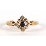 An 18ct diamond and sapphire ring. Approx. UK size N 2.1g