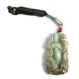 A Chinese jade / hardstone pendant decorated with a female figure with birds, 6cms high.