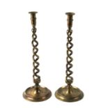 A large pair of brass open twist candlesticks, 45cms high.