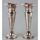 A pair of loaded silver posy vases, Birmingham 1923, total weight 360g, 18cms high.
