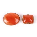 Two yellow metal mounted carnelian brooches, the largest 3cms wide (2).