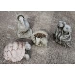 A group of four stoneware garden animals.