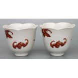 A pair of Chinese cups decorated bats with red seal mark to the underside. 9cm highCondition