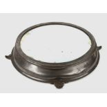 A large Victorian pewter mirrored wedding cake stand with engraved decoration, on four legs, 51cms