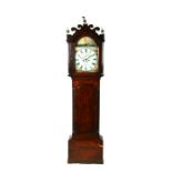 A 19th century longcase clock, the arched painted dial with Roman numerals, subsidiary seconds