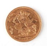 An Edward VII 1907 gold full sovereign.