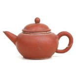 A Chinese Yixing teapot, impressed character mark to base, 8cms high.Condition ReportA chip to to