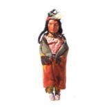 North American / Tribal Art: an early 20th century Native American Skookum doll with painted