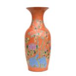 A large Chinese famille rose vase decorated with flowers on an orange ground, 57cms high.Condition