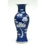 A Chinese blue & white baluster vase decorated with prunus, four character mark to base, 26cms