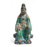 A Chinese Sancai glaze figure of Guanyin seated with a child on her knee, 42cms high.Condition