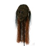 Oceanic / Tribal Art: a Papua New Guinea woven fibre headdress with cassowary feathers, on stand,