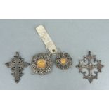 Two antique white metal religious crucifix pendants, each 6.5cms high; together with two French