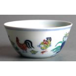 A Chinese Wucai style tea bowl decorated with chickens and flowers, blue six character mark to the
